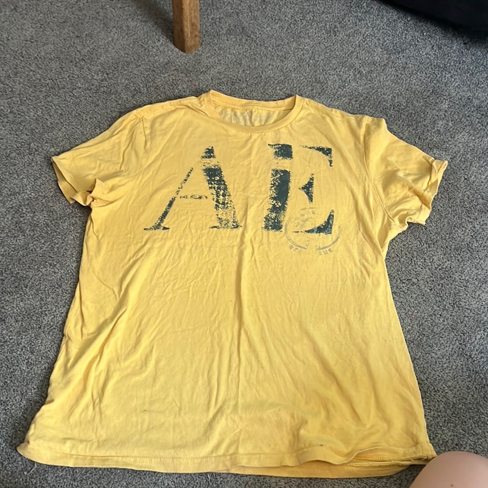 American eagle outfitters. Yellow t-shirt with blue lettering